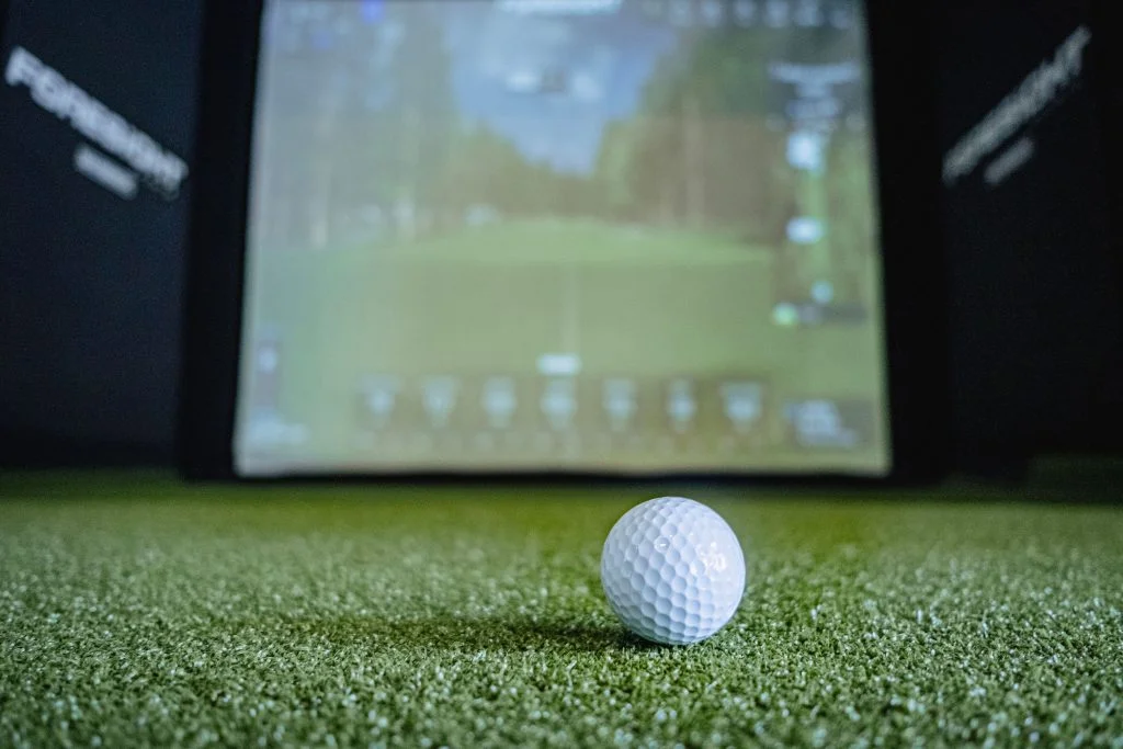 Golf ball on simulator turf